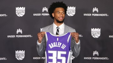 Jun 23, 2018; Sacramento, CA, USA; Sacramento Kings number two overall draft pick Marvin Bagley III poses with his jersey during an introduction press conference at Golden 1 Center. Mandatory Credit: Sergio Estrada-Imagn Images