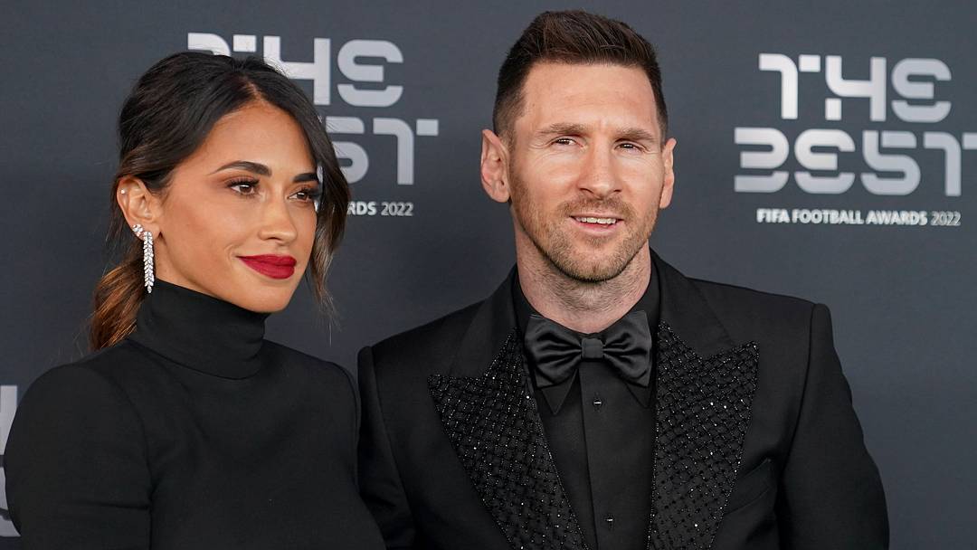 Lionel Messi and his wife Antonela Roccuzzo attend a red carpet event. 