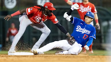 Mar 4, 2025; Phoenix, Arizona, USA; Los Angeles Dodgers designated hitter Shohei Ohtani is tagged out at second base by Cincinnati Reds shortstop Elly De La Cruz during a spring training game at Camelback Ranch-Glendale. Mandatory Credit: Mark J. Rebilas-Imagn Images