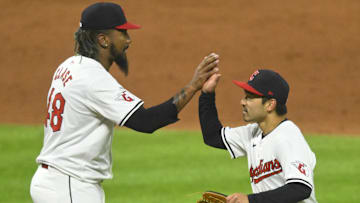 Apr 20, 2024; Cleveland, Ohio, USA; Cleveland Guardians relief pitcher Emmanuel Clase (48) and left fielder Steven Kwan (38) celebrate a win over the Oakland Athletics at Progressive Field