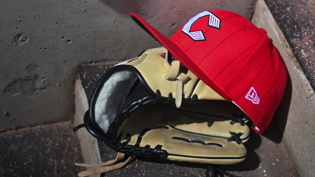 Apr 11, 2026; Cincinnati, Ohio, USA;  A view of an official Cincinnati Reds hat on the dugout steps during the game against the Los Angeles Angels at Great American Ball Park. Mandatory Credit: Aaron Doster-Imagn Images