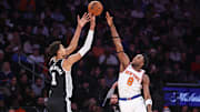 Dec 25, 2024; New York, New York, USA;  San Antonio Spurs center Victor Wembanyama (1) takes a three point shot past New York Knicks forward OG Anunoby (8) in the fourth quarter at Madison Square Garden. Mandatory Credit: Wendell Cruz-Imagn Images