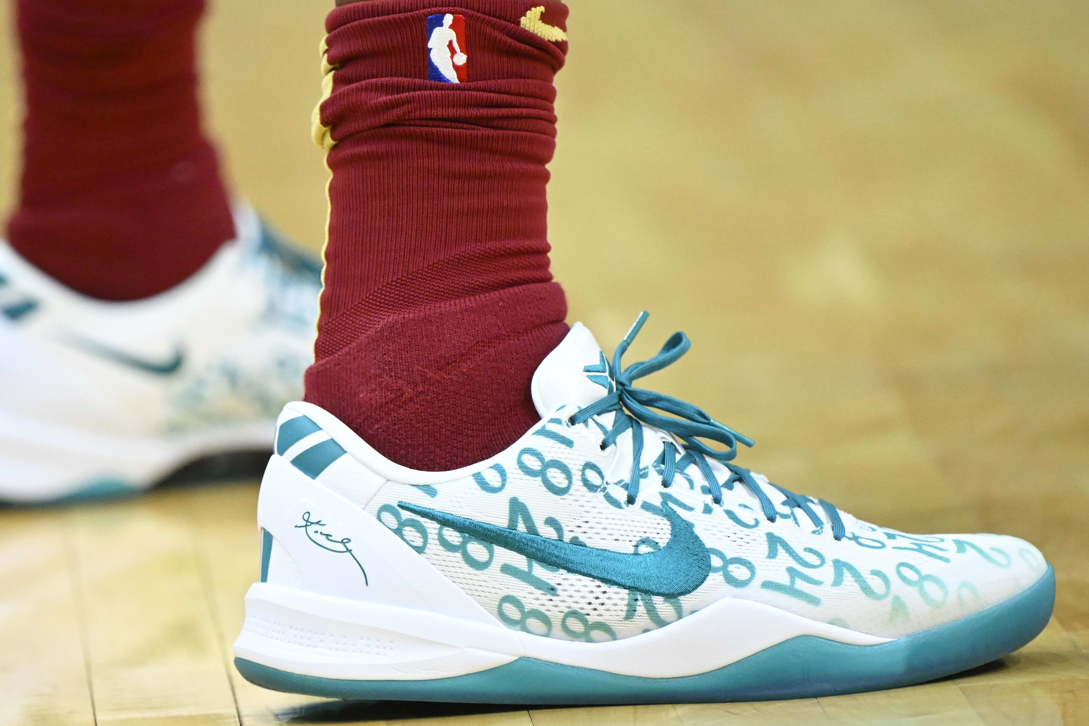 Cleveland Cavaliers forward Marcus Morris Sr.'s white and teal Nike sneakers.