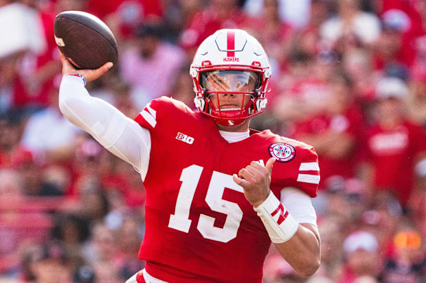 Dylan Raiola (15), quarterback of the Nebraska Cornhuskers, throws a pass against the Rutgers Scarlet Knights