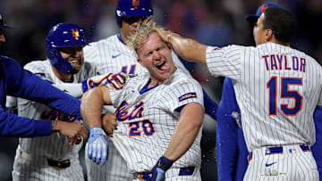 May 12, 2025; New York City, New York, USA; New York Mets first baseman Pete Alonso (20) celebrates with teammates after his ninth inning walkoff RBI sacrifice fly against the Pittsburgh Pirates at Citi Field. Mandatory Credit: Brad Penner-Imagn Images