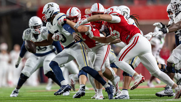 Nebraska defensive lineman Ashton Murphy sacks Akron's Michael Johnson Jr. for a loss of 11 yards.