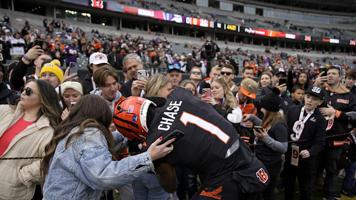 Cincinnati Bengals wide receiver Ja'Marr Chase (1) signs autographs for fans before the Bengals face the Minnesota Vikings at Paycor Stadium Saturday, December 16, 2023.