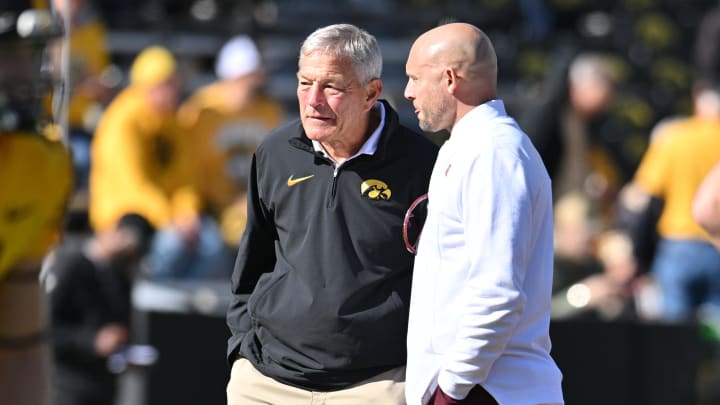 Oct 21, 2023; Iowa City, Iowa, USA; Iowa Hawkeyes head coach Kirk Ferentz and Minnesota Golden Gophers head coach P.J. Fleck talk before a game at Kinnick Stadium. Mandatory Credit: Jeffrey Becker-USA TODAY Sports