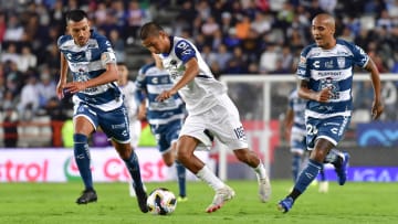 Pachuca's Gustavo Cabral (left) and Luis Rodríguez (right) give chase to Monterrey's Alessandro Tagle in Liga MX action on Sunday. The Tuzos lost their season opener 1-0.