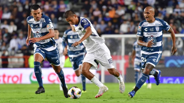 Pachuca's Gustavo Cabral (left) and Luis Rodríguez (right) give chase to Monterrey's Alessandro Tagle in Liga MX action on Sunday. The Tuzos lost their season opener 1-0.