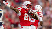 Nebraska running back Emmett Johnson signals a first down after picking up 36 yards against Akron.