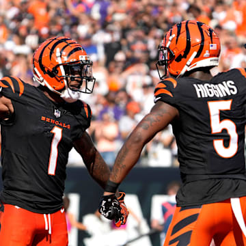 Cincinnati Bengals wide receiver Ja'Marr Chase (1) and wide receiver Tee Higgins (5) celebrate Higgins touchdown in the 3rd quarter over the Baltimore Ravens on Sunday, October 6, 2024, at Payor Stadium.