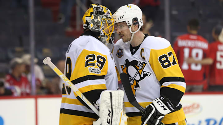 Apr 29, 2017; Washington, DC, USA; Pittsburgh Penguins goalie Marc-Andre Fleury (29) celebrates with Penguins center Sidney Crosby (87) after defeating the Washington Capitals 6-2 during the third period in game two of the second round of the 2017 Stanley Cup Playoffs at Verizon Center. Mandatory Credit: Geoff Burke-Imagn Images