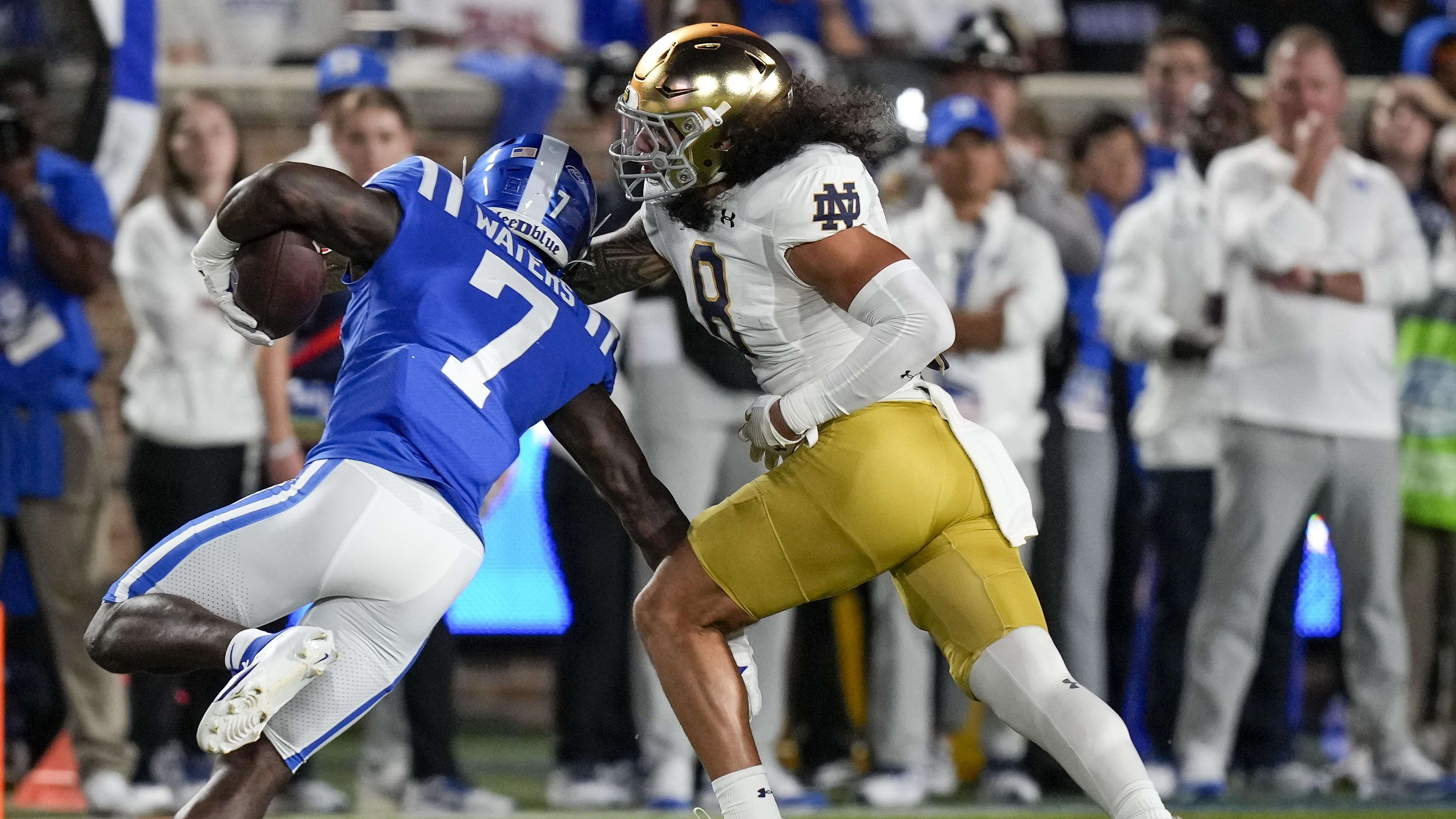 Notre Dame Fighting Irish linebacker Marist Liufau attempts to make a tackle on a Duke ballcarrier.