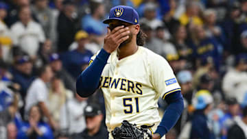 Oct 14, 2025; Milwaukee, Wisconsin, USA; Milwaukee Brewers pitcher Freddy Peralta (51) reacts after giving up a solo home run to Los Angeles Dodgers right fielder Teoscar Hernandez (not pictured) in the second inning during game two of the NLCS round for the 2025 MLB playoffs at American Family Field. Mandatory Credit: Benny Sieu-Imagn Images