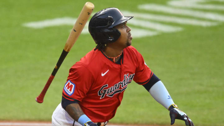 Aug 24, 2024; Cleveland, Ohio, USA; Cleveland Guardians third baseman Jose Ramirez (11) tosses his bat after hitting a single in the first inning against the Texas Rangers at Progressive Field.