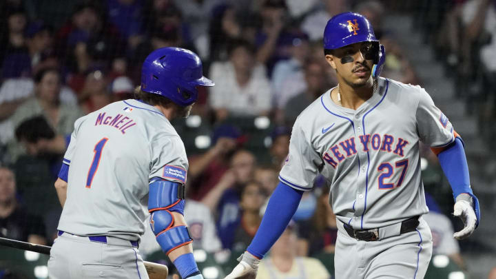 Jun 23, 2024; Chicago, Illinois, USA; New York Mets Mark Vientos (27) is greeted by second baseman Jeff McNeil (1) after hitting a home run against the Chicago Cubs during the eighth inning at Wrigley Field. Mandatory Credit: David Banks-USA TODAY Sports