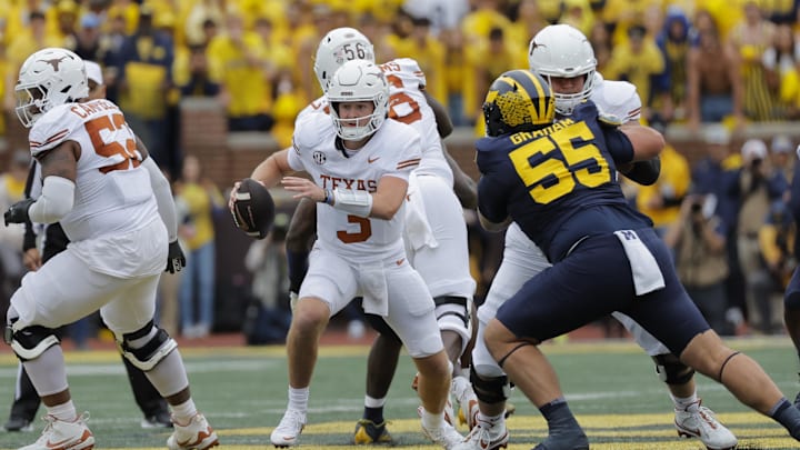 Sep 7, 2024; Ann Arbor, Michigan, USA; Texas Longhorns quarterback Quinn Ewers (3) rushes in the first half against the Michigan Wolverines at Michigan Stadium. Mandatory Credit: Rick Osentoski-Imagn Images