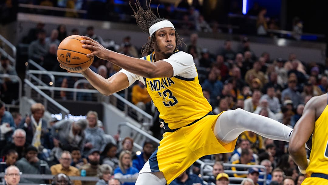 Jan 18, 2025; Indianapolis, Indiana, USA; Indiana Pacers center Myles Turner (33) rebounds the ball in the second half against the Philadelphia 76ers at Gainbridge Fieldhouse. Mandatory Credit: Trevor Ruszkowski-Imagn Images