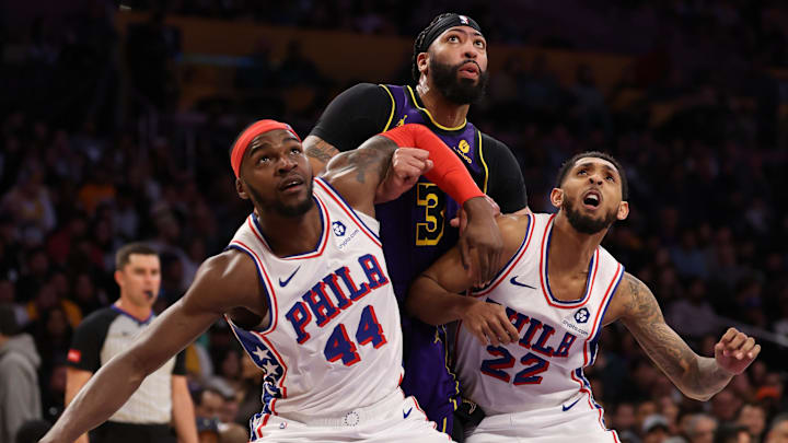 Mar 22, 2024; Los Angeles, California, USA;  Los Angeles Lakers forward Anthony Davis (3) box out by Philadelphia 76ers forward Paul Reed (44) and guard Cameron Payne (22) during the third quarter at Crypto.com Arena. Mandatory Credit: Kiyoshi Mio-Imagn Images