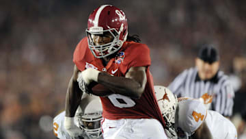 Jan 7, 2010; Pasadena, CA, USA; Alabama Crimson Tide wide receiver Julio Jones (8) runs past Texas Longhorns cornerback Aaron Williams (4) during the first quarter of the 2010 BCS national championship game at the Rose Bowl.  Mandatory Credit: Kirby Lee-Imagn Images