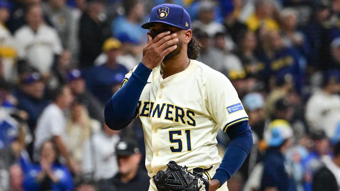 Oct 14, 2025; Milwaukee, Wisconsin, USA; Milwaukee Brewers pitcher Freddy Peralta (51) reacts after giving up a solo home run to Los Angeles Dodgers right fielder Teoscar Hernandez (not pictured) in the second inning during game two of the NLCS round for the 2025 MLB playoffs at American Family Field. Mandatory Credit: Benny Sieu-Imagn Images