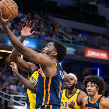 May 12, 2024; Indianapolis, Indiana, USA; New York Knicks guard Shake Milton (13)  shoots the ball while Indiana Pacers forward Jalen Smith (25) defends during game four of the second round for the 2024 NBA playoffs at Gainbridge Fieldhouse. Mandatory Credit: Trevor Ruszkowski-USA TODAY Sports
