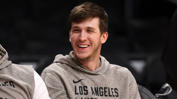 Mar 8, 2024; Los Angeles, California, USA;  Los Angeles Lakers guard Austin Reaves (15, right) smiles on the bench prior to the game against the Milwaukee Bucks at Crypto.com Arena. Mandatory Credit: Kiyoshi Mio-USA TODAY Sports