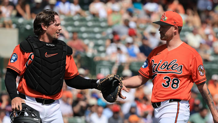 Feb 28, 2026; Sarasota, Florida, USA;  Baltimore Orioles starting pitcher Kyle Bradish (38)  is congratulated by  catcher Adley Rutschman (35) at the end of the third inning against the Atlanta Braves at Ed Smith Stadium. Mandatory Credit: Kim Klement Neitzel-Imagn Images