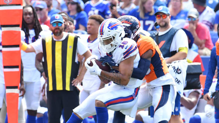 Aug 20, 2022; Orchard Park, NY; Buffalo Bills wide receiver Isaiah Hodgins (16) is tackled by Denver Broncos cornerback Bless Austin (38) after a catch in the second quarter of a pre-season game at Highmark Stadium.