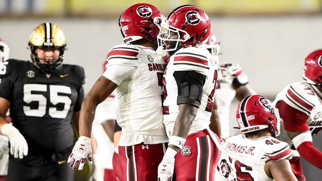 Nov 9, 2024; Nashville, Tennessee, USA;  South Carolina Gamecocks linebacker Bam Martin-Scott (22) celebrates the sack of Vanderbilt Commodores quarterback Diego Pavia (2) with defensive back Nick Emmanwori (7) at FirstBank Stadium. Mandatory Credit: Steve Roberts-Imagn Images