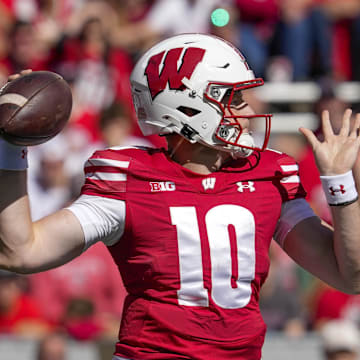 Sep 7, 2024; Madison, Wisconsin, USA;  Wisconsin Badgers quarterback Tyler Van Dyke (10) throws a pass during the second quarter against the South Dakota Coyotes at Camp Randall Stadium. Mandatory Credit: Jeff Hanisch-Imagn Images