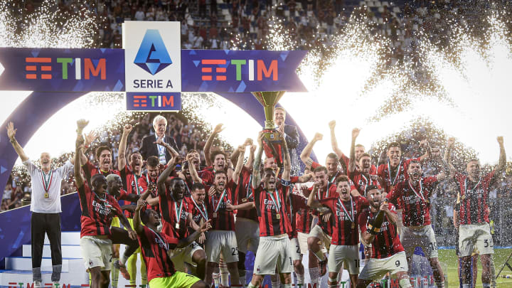 Alessio Romagnoli (C) of AC Milan lifts the Scudetto trophy...