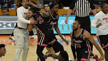 Apr 5, 2025; San Antonio, TX, USA; Houston Cougars guard Emanuel Sharp (21) reacts after defeating the Duke Blue Devils in the semifinals of the men's Final Four of the 2025 NCAA Tournament at Alamodome. Mandatory Credit: Scott Wachter-Imagn Images

