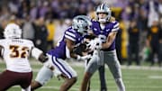 Nov 16, 2024; Manhattan, Kansas, USA; Kansas State Wildcats quarterback Avery Johnson (2) hands off to running back DJ Giddens (31) against the Arizona State Sun Devils during the fourth quarter at Bill Snyder Family Football Stadium. Mandatory Credit: Scott Sewell-Imagn Images