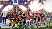 Alessio Romagnoli (C) of AC Milan lifts the Scudetto trophy...