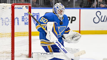 Apr 5, 2025; St. Louis, Missouri, USA;  St. Louis Blues goaltender Jordan Binnington (50) defends the net against the Colorado Avalanche during the first period at Enterprise Center. Mandatory Credit: Jeff Curry-Imagn Images