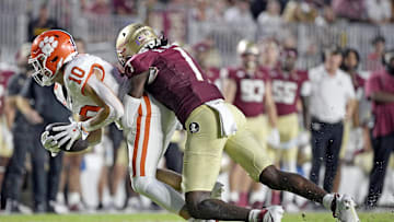 Oct 5, 2024; Tallahassee, Florida, USA; Clemson Tigers wide receiver Troy Stellato (10) is tackled by Florida State Seminoles defensive back Shyheim Brown (1) during the first half at Doak S. Campbell Stadium. Mandatory Credit: Melina Myers-Imagn Images
