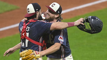 Sep 12, 2025; Cleveland, Ohio, USA; Cleveland Guardians catcher Austin Hedges (27) and starting pitcher Tanner Bibee (28) celebrate a win over the Chicago White Sox at Progressive Field. Mandatory Credit: David Richard-Imagn Images