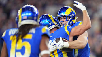 Los Angeles Rams tight end Davis Allen (87) celebrates his touchdown catch with teammate Cooper Kupp (10) during their playoff game against the Minnesota Vikings at State Farm Stadium on Jan. 13, 2025, in Glendale.