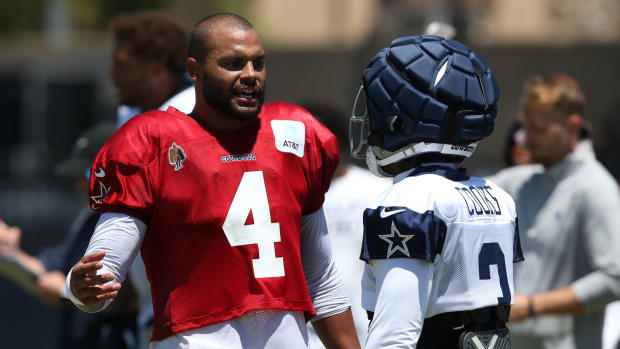 Dallas Cowboys quarterback Dak Prescott (4) talks to wide receiver Brandin Cooks 