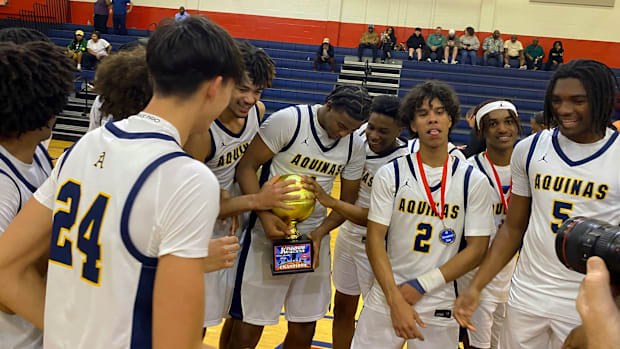 St. Thomas Aquinas players celebrate after winning the 51st annual Kingdom of the Sun Tournament at Ocala Vanguard on Monday.