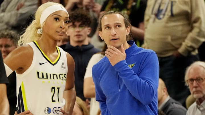 Dallas Wings guard DiJonai Carrington (21) talks to head coach Chris Koclanes as they play the Minnesota Lynx in the fourth quarter at Target Center. Dallas Wings guard DiJonai Carrington (21) talks to head coach Chris Koclanes as they play the Minnesota Lynx in the fourth quarter at Target Center.