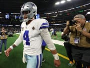 Cowboys quarterback Dak Prescott walks off the field after losing to the Packers in the 2024 NFC wild-card game.