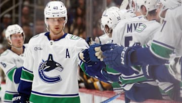 Nov 27, 2024; Pittsburgh, Pennsylvania, USA;  Vancouver Canucks center Elias Pettersson (40) celebrates his goal with the Canucks bench against the Pittsburgh Penguins during the third period at PPG Paints Arena. Mandatory Credit: Charles LeClaire-Imagn Images