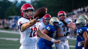 Brentwood Academy's George MacIntyre (12) crosses the goal line for a touchdown against Brentwood at