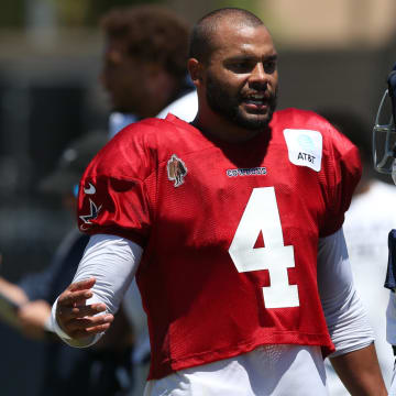 Jul 30, 2024; Oxnard, CA, USA; Dallas Cowboys quarterback Dak Prescott (4) talks to wide receiver Brandin Cooks (3) during training camp at the River Ridge Playing Fields in Oxnard, California. 