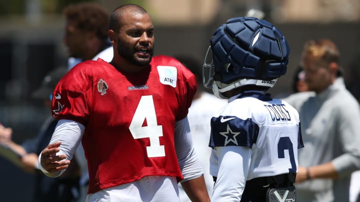 Jul 30, 2024; Oxnard, CA, USA; Dallas Cowboys quarterback Dak Prescott (4) talks to wide receiver Brandin Cooks (3) during training camp at the River Ridge Playing Fields in Oxnard, California. 