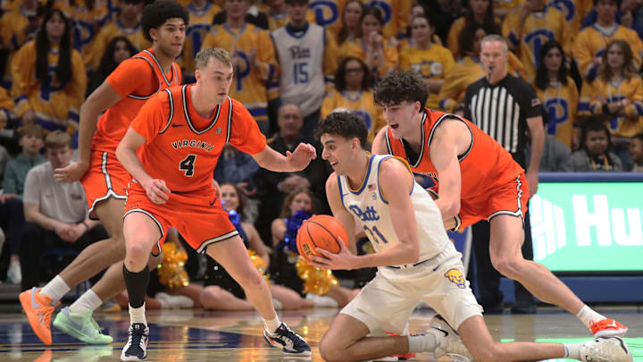 Feb 3, 2025; Pittsburgh, Pennsylvania, USA; Pittsburgh Panthers forward Jorge Diaz Graham (31) attempts to pass the ball as Virginia Cavaliers guard Andrew Rohde (4) and forward Blake Buchanan (right) defend during the second half at the Petersen Events Center. Mandatory Credit: Charles LeClaire-Imagn Images Feb 3, 2025; Pittsburgh, Pennsylvania, USA; Pittsburgh Panthers forward Jorge Diaz Graham (31) attempts to pass the ball as Virginia Cavaliers guard Andrew Rohde (4) and forward Blake Buchanan (right) defend during the second half at the Petersen Events Center. Mandatory Credit: Charles LeClaire-Imagn Images