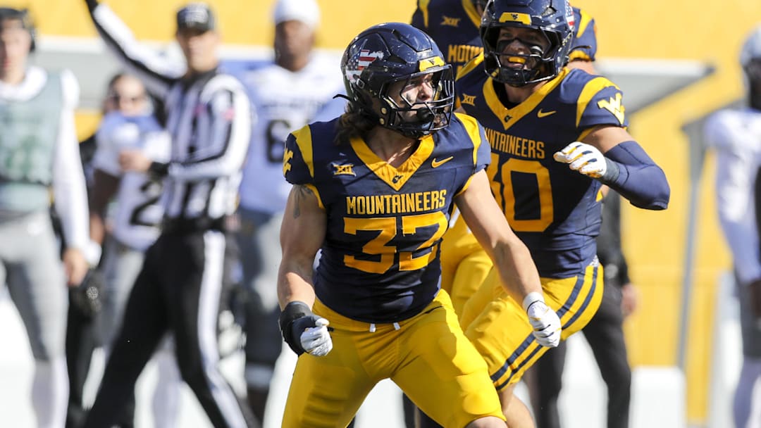 Nov 8, 2025; Morgantown, West Virginia, USA; West Virginia Mountaineers linebacker Ben Bogle (32) celebrates after a sack during the first quarter against the Colorado Buffaloes at Milan Puskar Stadium. Mandatory Credit: Ben Queen-Imagn Images